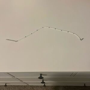 white and some blue colored beaded necklace